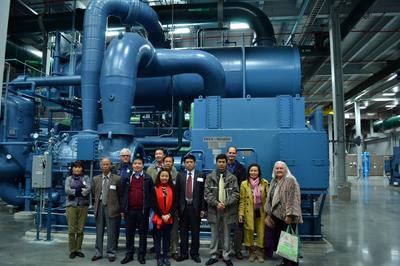 The VCEP group standing in front of an 8,000 ton chiller in the Thermal Energy Corporation in Houston.