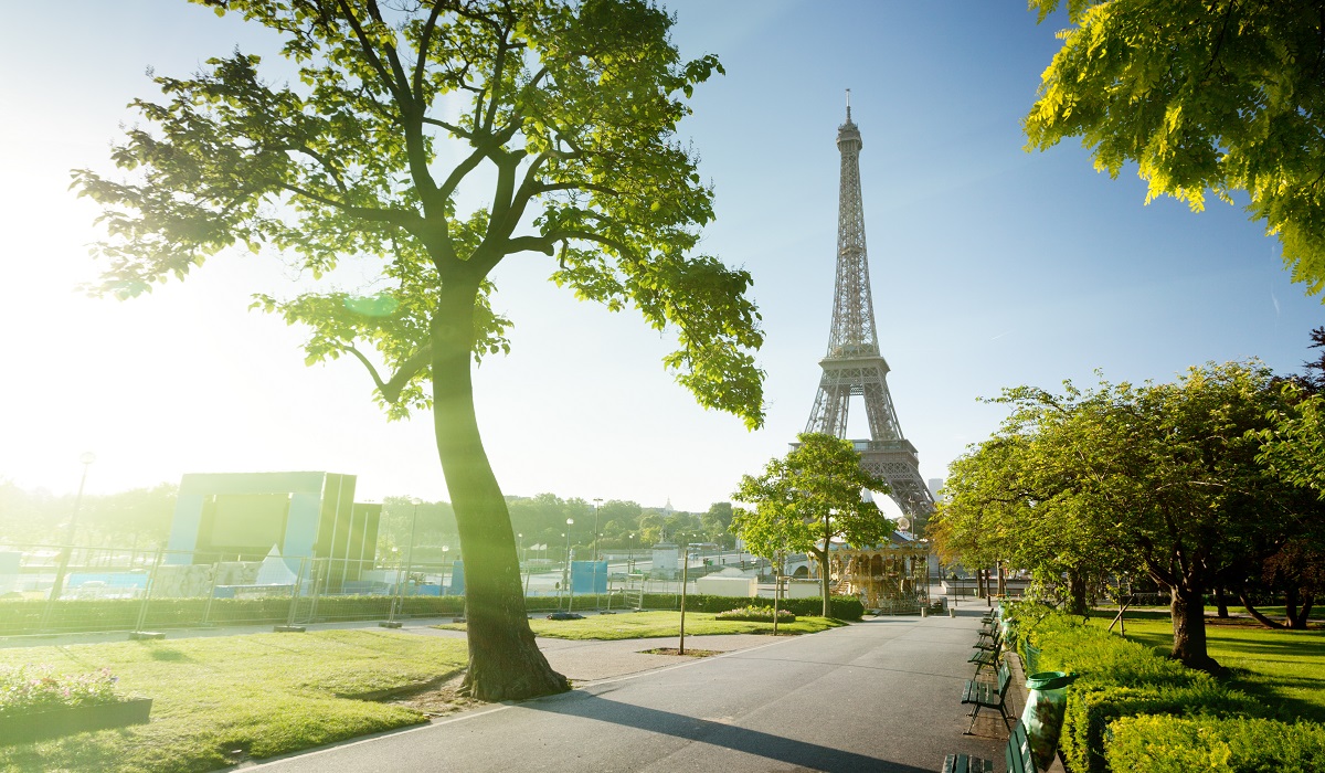 Eiffel Tower on a sunny day. Rejoining the Paris Agreement.