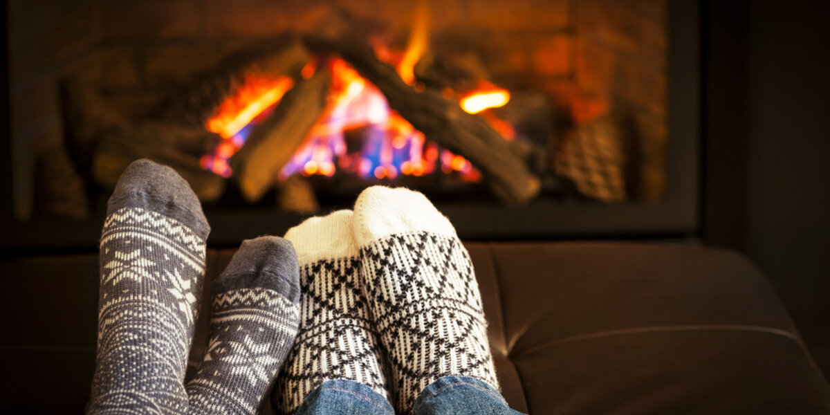 Feet warming by the fire during the winter