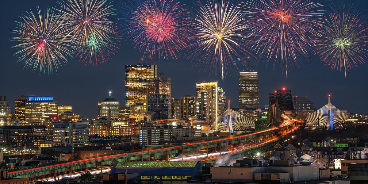 Fourth of July fireworks over city. 